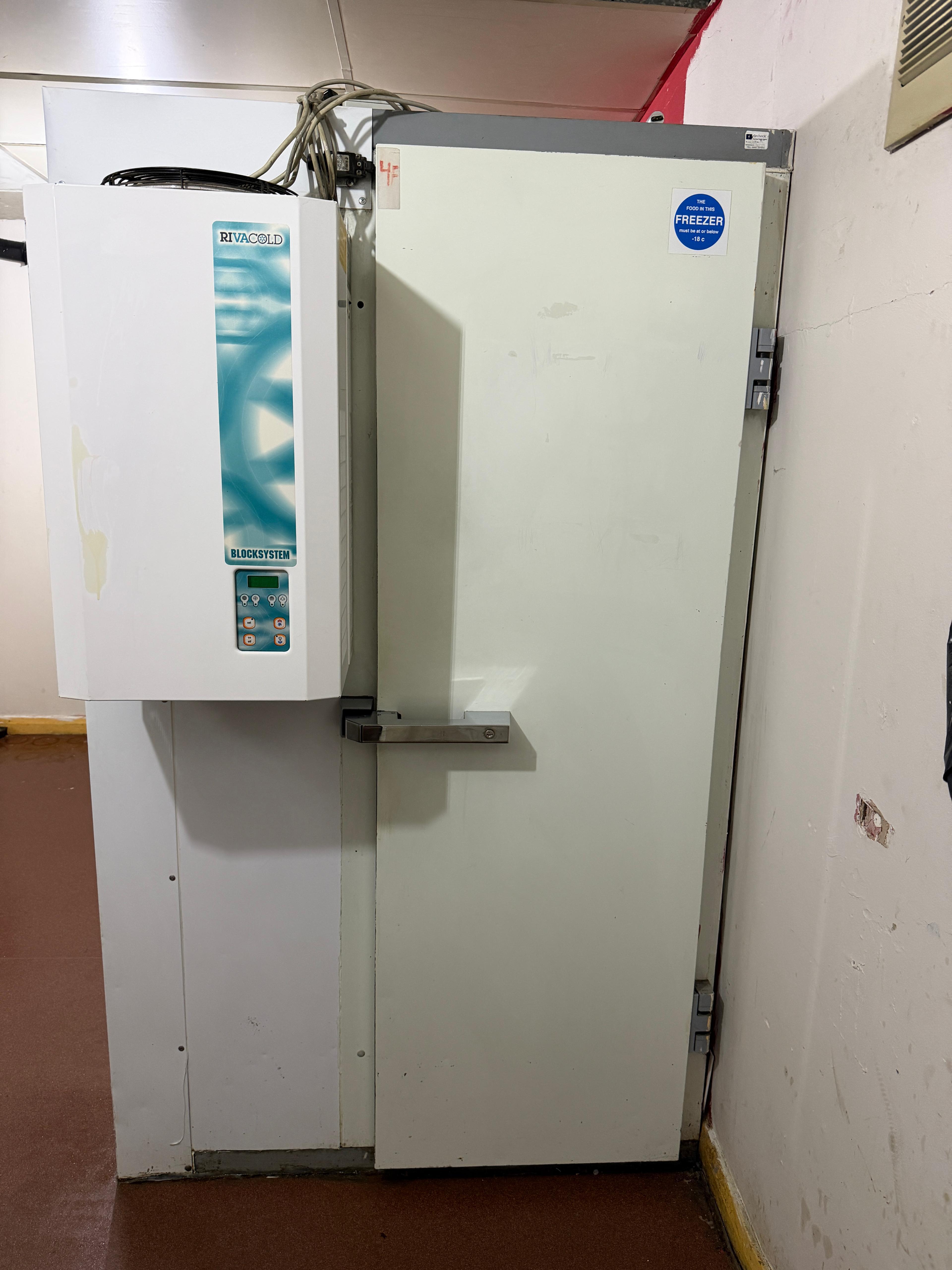 The same commercial cold-room door after cleaning